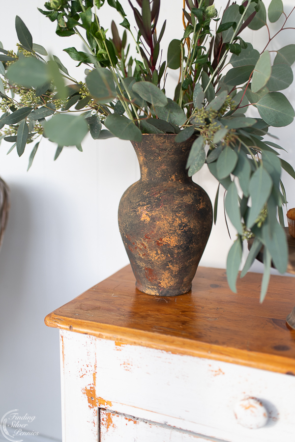 Faux Earthenware Vase Finding Silver Pennies