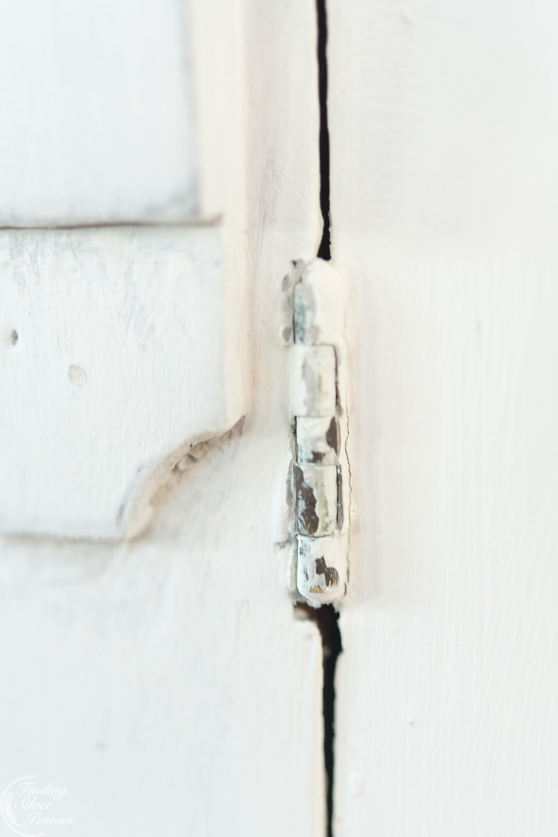 close up of painted hinge and distressing